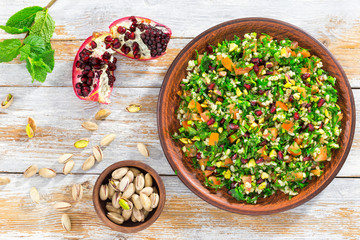 delicious tabbouleh salad with pomegranate, pistachio nuts