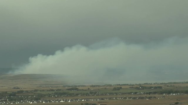 Grassfire Smoke Plume Sweeps Over Farms