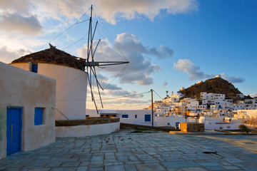 Windmill in Chora of Ios island at sunset.