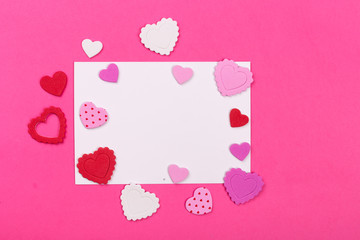 Photo frame or gift card with valentines heart shaped ribbon ove