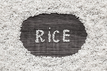 Word rice on the rice background. Healthy eating and lifestyle.