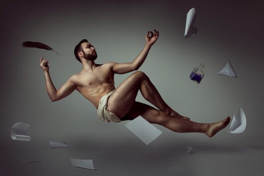Half naked handsome man poet levitating with his literary things