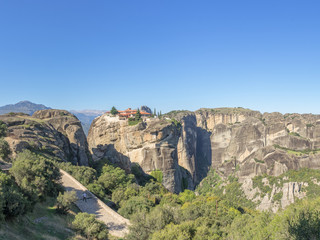 Fototapeta na wymiar Panoramic view on Holy Trinity Meteora monastery on rocks. Thessaly, Greece. 