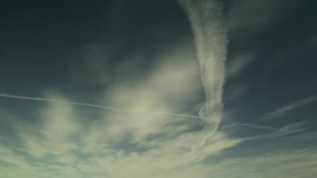 Cirrus Clouds and Contrails Ride Jet Stream Winds