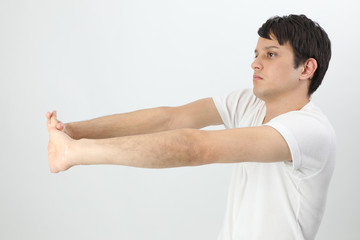 Obraz premium stretching young man