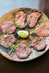 Barbecue sliced beef tongue marinated in pepper, onion, sesame oil and soy sauce.