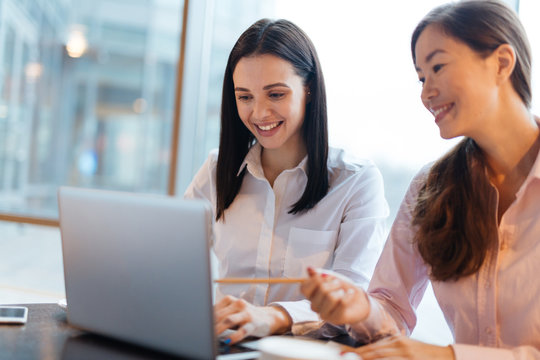 Two Friends Working in Office