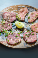 Barbecue sliced beef tongue marinated in pepper, onion, sesame oil and soy sauce.