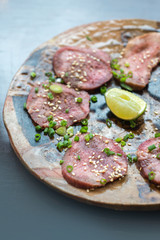 Barbecue sliced beef tongue marinated in pepper, onion, sesame oil and soy sauce.