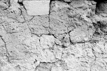 Wall fragment with scratches and cracks
