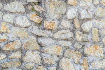 grey stone wall with grey concrete lines