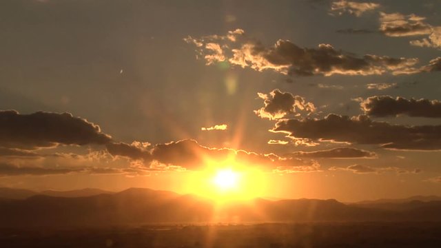 Golden Sunset Time Lapse Clouds over Rocky Mountains
