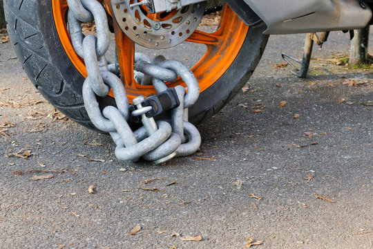 Motorcycle anti-theft chain with padlock security lock on rear w