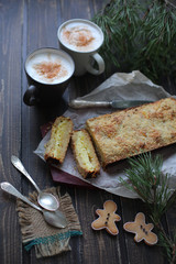rectangular cake is a breakdown on wooden background