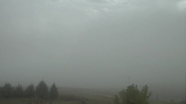 Fog Banks Clash over Ranchland