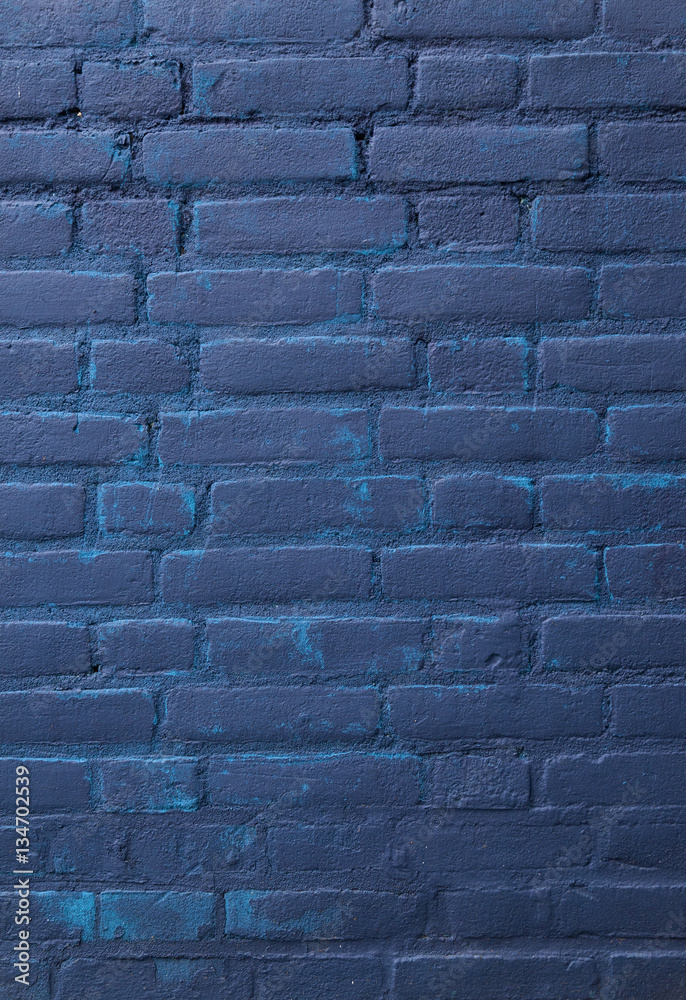 Wall mural dark blue painted part of brick wall