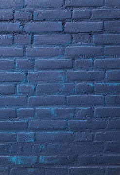 dark blue painted part of brick wall