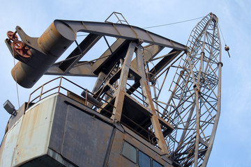 Fototapeta na wymiar View of an old industrial crane in the ancient port of Genoa, Genova, Italy