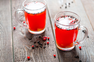 Two Cups of Red Hot Tea Drink on a Wooden Background, Winter Hot Drinks Concept