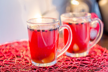 Two Cups of Hot Red Christmas Drink, Light Blurred Background, Horizontal View