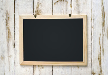 Blank blackboard on wooden background.