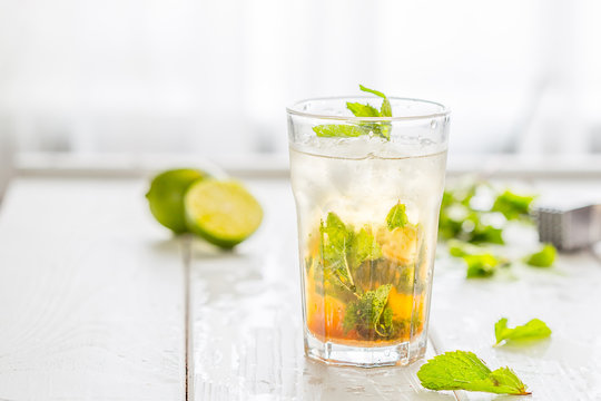 Fresh Mojito Cocktail isolated on a White Wooden Background with Free Space for Your text, Horizontal View
