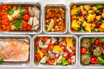 Healthy food take away, top view at wood background