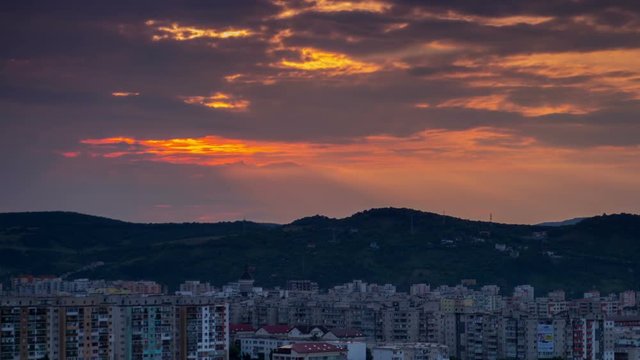 Sunset over old city buildings 