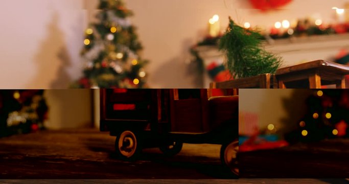 Toy truck carrying a christmas tree on wooden table during christmas time 4k