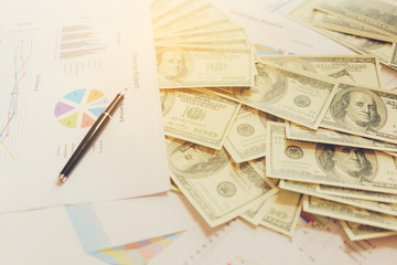Business concept , ball pen , Financial report and U.S. dollar bills