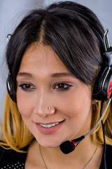 Egyptian Female customer support operator with headset and smiling