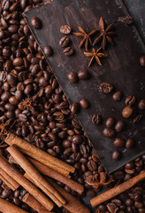 Broken slices of chocolate and coffee beans. Chocolate chocolate chunks. Chocolate bar pieces. A...