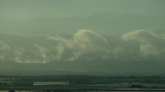 Cold Air Above Warm  Mountain Lake Creates Clouds
