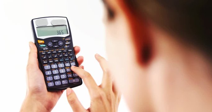 Businesswoman using calculator against white background 4k