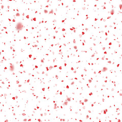 Fototapeta na wymiar Valentines Day background of red hearts petals falling on white background