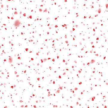 Valentines Day background of red hearts petals falling on white background