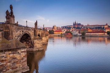 Fototapeta premium Prague. Cityscape image of Prague with Charles Bridge during sunrise.