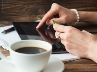 Close up of businesswoman hands shopping online with digital tablet