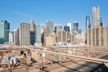 Fototapeta na wymiar New York city buildings view from Brooklyn Bridge, empty street