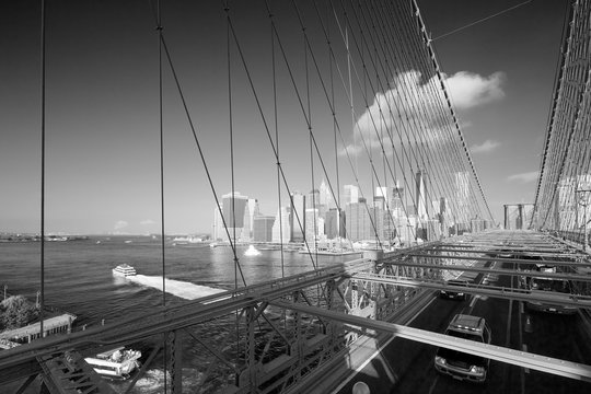 Fototapeta Brooklyn Bridge with passing cars view and New York city skyline