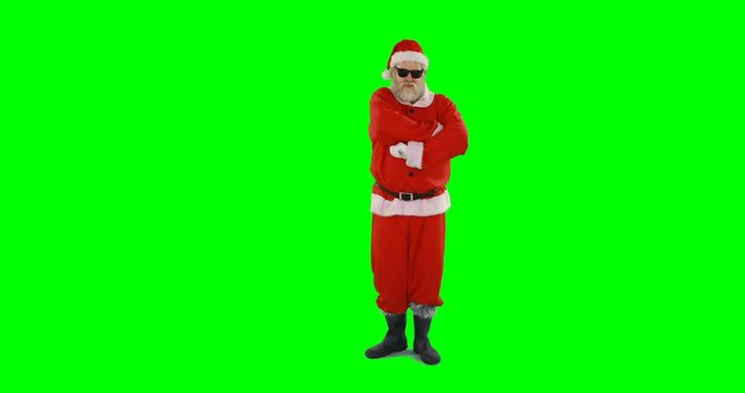 Santa claus posing with sunglasses against green background 4k