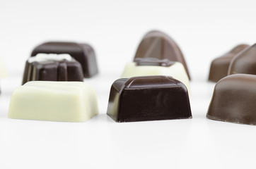 Assortment Of Fine Chocolates In White, Dark And Milk Chocolate Closeup