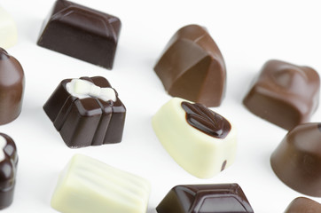 Assortment Of Fine Chocolates In White, Dark And Milk Chocolate Closeup