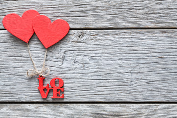 Valentine day background, handmade hearts on wood with copy space