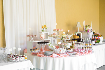 Look from afar at little round table served with delicious weddi