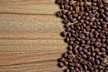 Coffee beans on a wooden table border