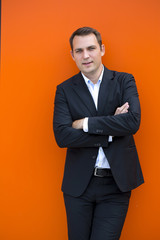 Portrait of a young business man in a dark suit and white shirt