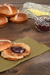 toasted hot cross bun with strawberry jam
