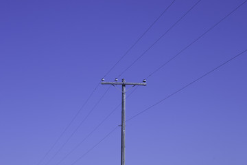 Telephone pole and blue sky