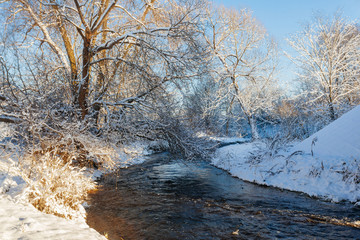 Winter park with snow trail and river at sun day